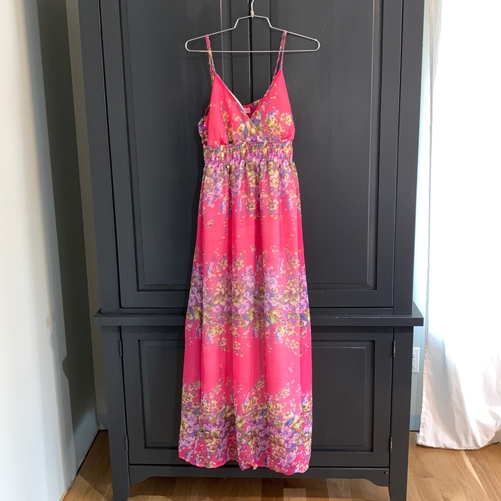 Pink floral maxi spaghetti strap dress with blue and purple flowers.